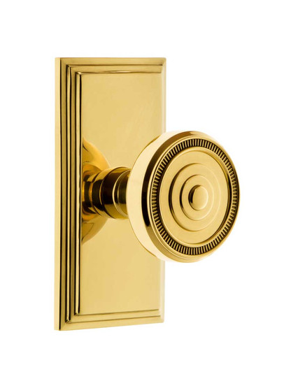 Grandeur Carre Rosette Door Set with Soleil Knobs in Polished Brass.